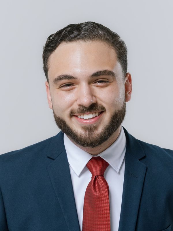 Illustrative stock headshot; not a photograph of the reviewer