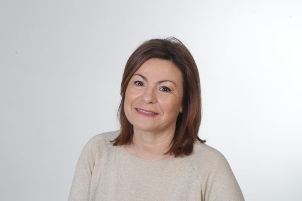 Illustrative stock headshot; not a photograph of the reviewer