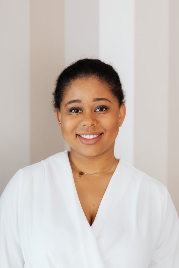 Illustrative stock headshot; not a photograph of the reviewer